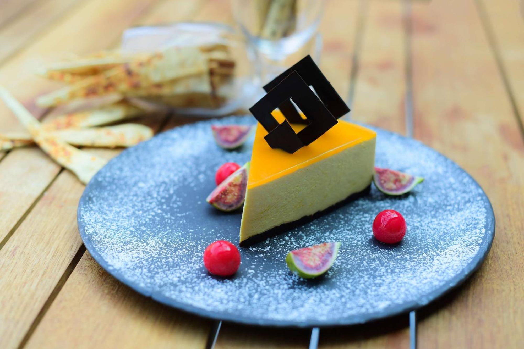 Radisson Blu Hotel Guwahati Dış mekan fotoğraf A slice of mango cheesecake